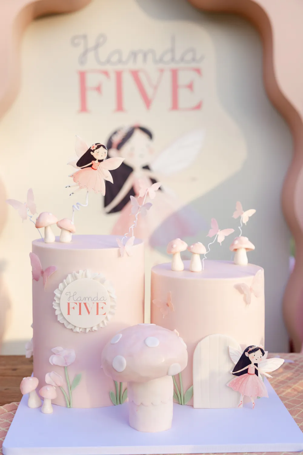 Pink and lilac fairy themed birthday cake with fairy details
