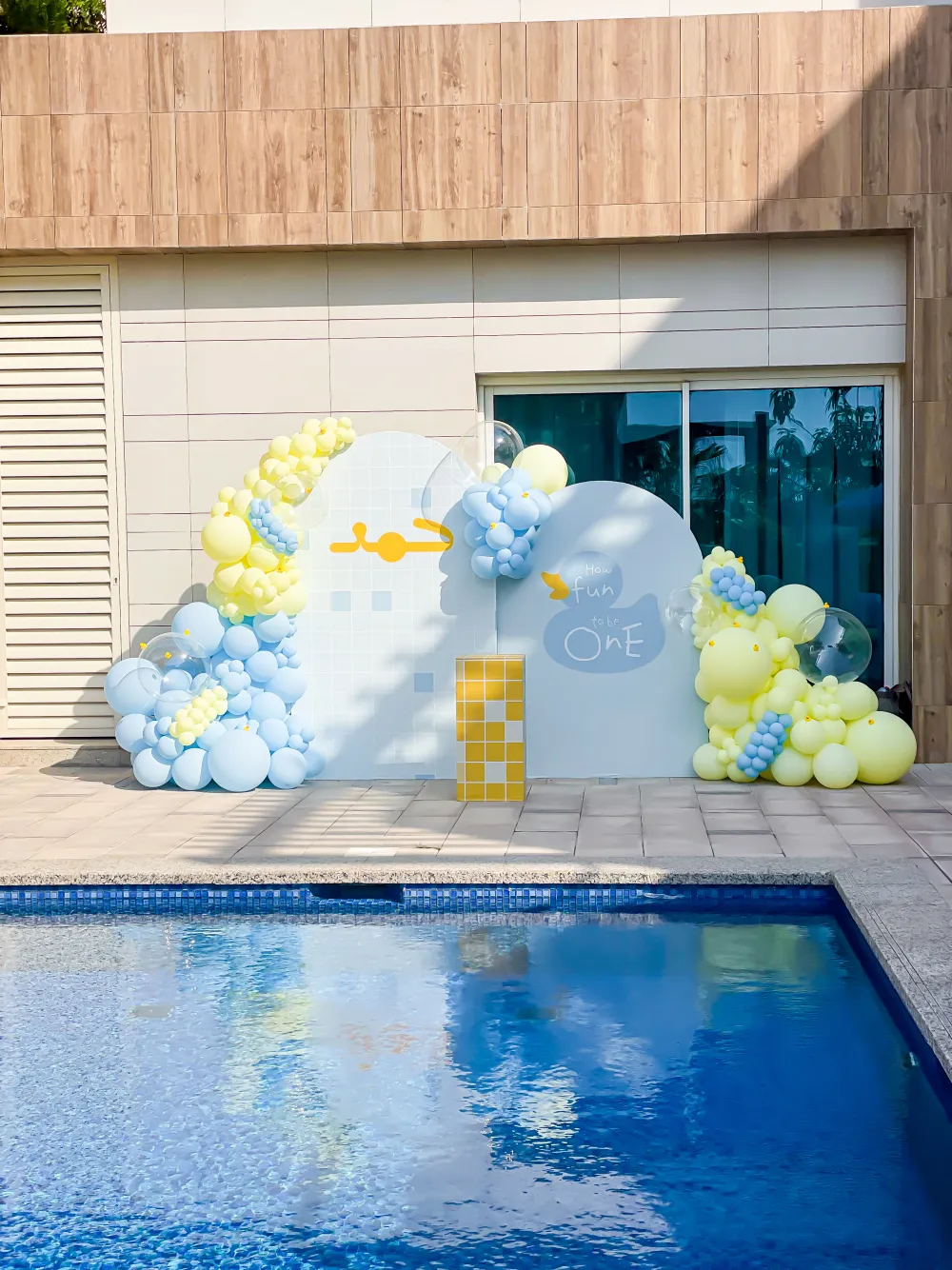 Blue and yellow little duck first birthday by the pool