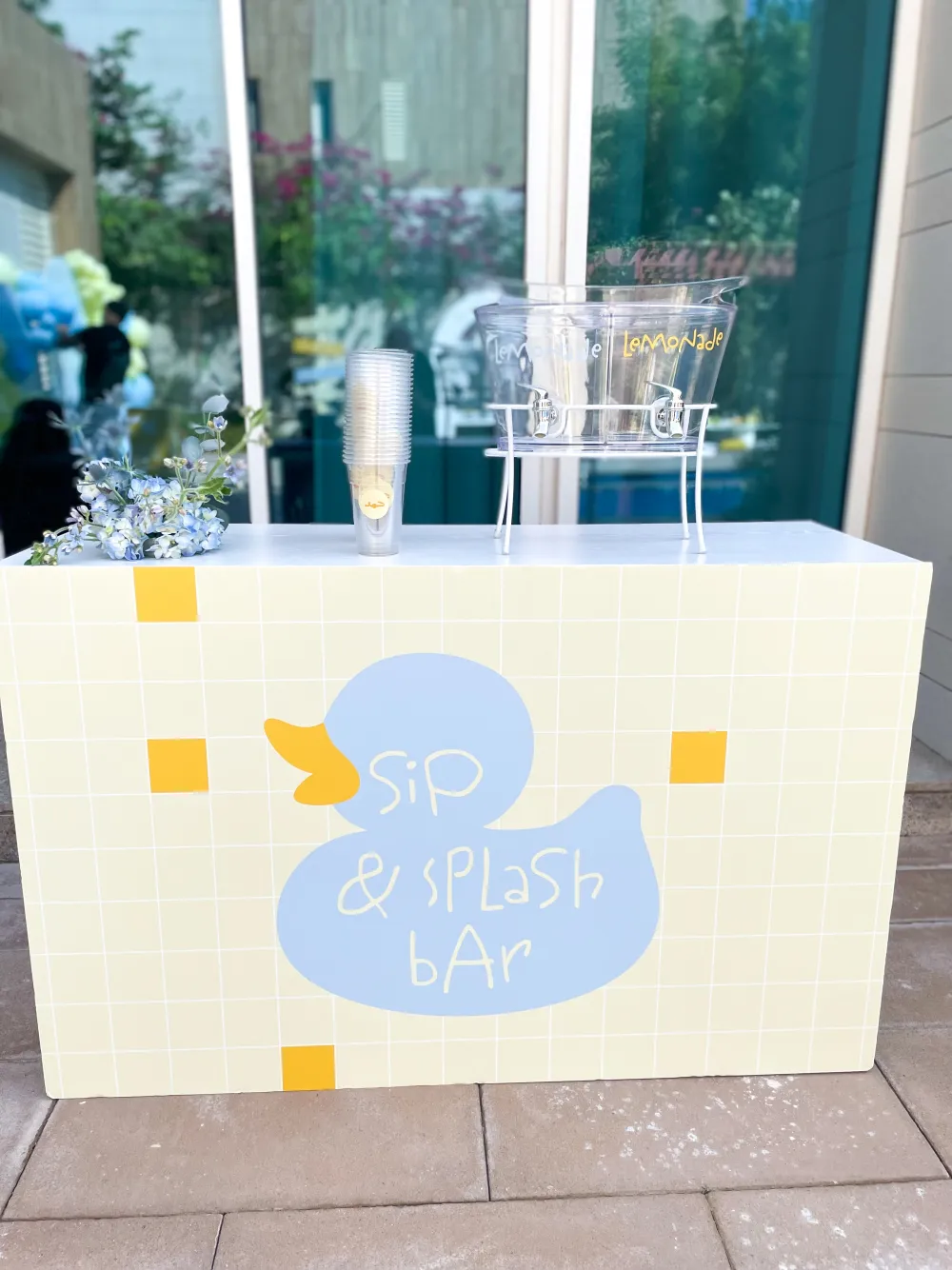 Duck themed birthday table setting in blue and yellow